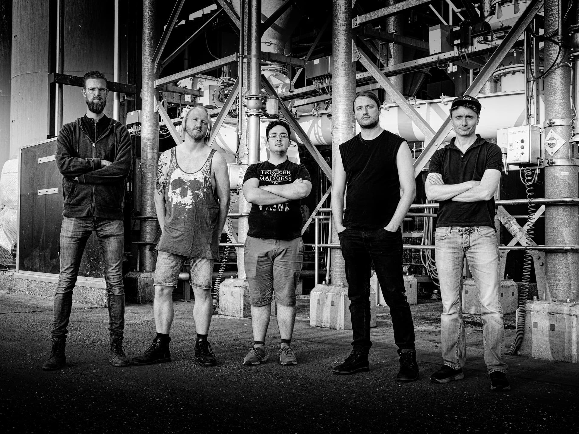 Seven Spirits Burning band group photo, industrial backdrop